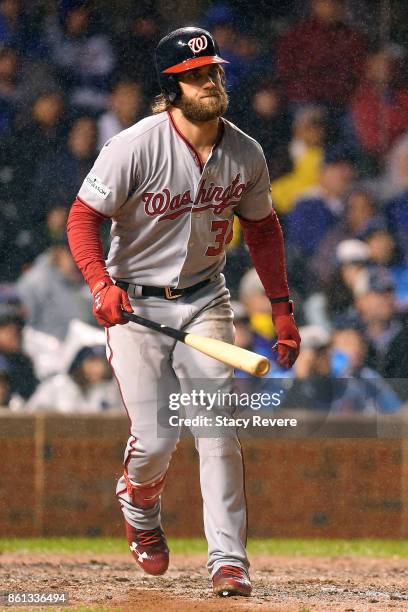 Bryce Harper of the Washington Nationals reacts to a pitch during game four of the National League Division Series against the Chicago Cubs at...