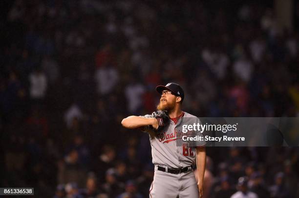 Sean Doolittle of the Washington Nationals prepares to throw a pitch during game four of the National League Division Series against the Chicago Cubs...