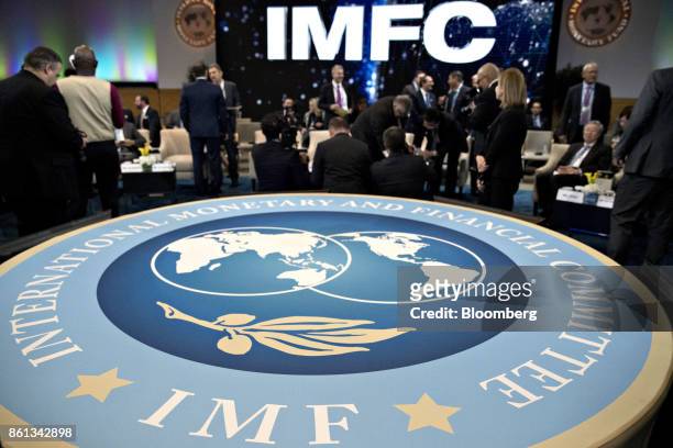 Attendees wait to begin an International Monetary Fund Committee plenary session at the International Monetary Fund and World Bank Group Annual...