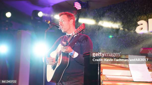 Chris Martin performs onstage at amfAR Los Angeles 2017 at Ron Burkle's Green Acres Estate on October 13, 2017 in Beverly Hills, Californi