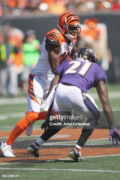 Green of the Cincinnati Bengals runs the football upfield against Lardarius Webb of the Baltimore Ravens during their game at Paul Brown Stadium on...