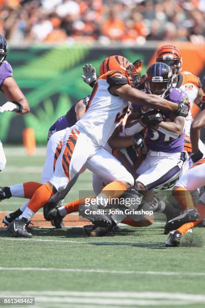Vincent Rey of the Cincinnati Bengals makes the tackle on Javorius Allen of the Baltimore Ravens during their game at Paul Brown Stadium on September...