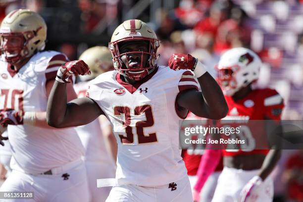 Jon Hilliman of the Boston College Eagles celebrates after rushing for a six-yard touchdown in the third quarter of a game against the Louisville...