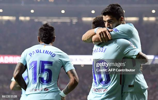 Barcelona's Uruguayan forward Luis Suarez celebrates a goal with Barcelona's Argentinian forward Lionel Messi during the Spanish league football...