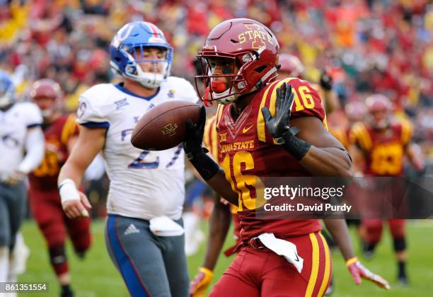 Wide receiver Marchie Murdock of the Iowa State Cyclones runs into the end zone for a touchdown as cornerback DeAnte Ford of the Kansas Jayhawks...