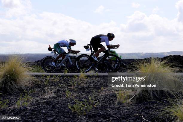 Cameron Wurf of Australia and Lionel Sanders of Canada compete on the bikes during the IRONMAN World Championship on October 14, 2017 in Kailua Kona,...