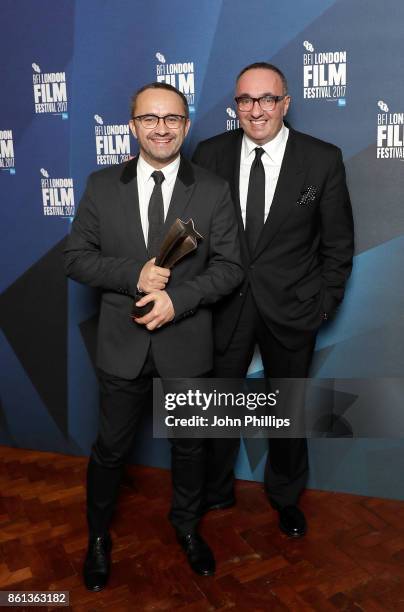 Andrey Zvyagintsev and Alexander Rodnyansky pose in the winners room with their Official Competition Best Film award for 'Loveless' at the 61st BFI...