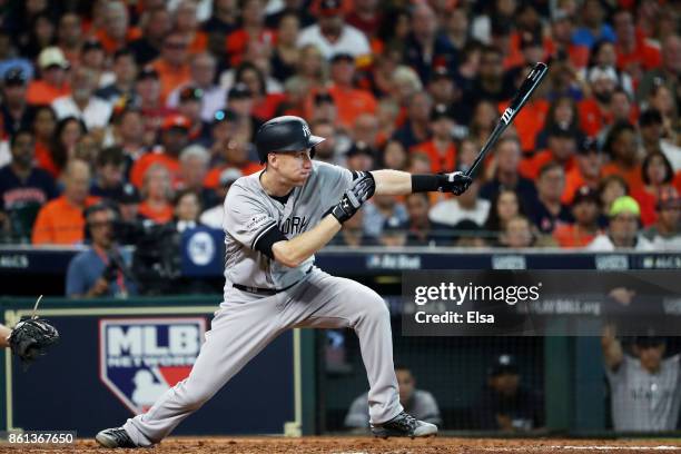 Todd Frazier of the New York Yankees hits a ground-rule double scoring Aaron Hicks in the fifth inning against the Houston Astros during game two of...