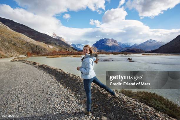 girl smiles at camera in patagonia - argentina dirt road panorama stock pictures, royalty-free photos & images