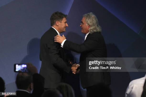 Tim Bevan presents Paul Greengrass with the BFI Fellowship Award on stage during the 61st BFI London Film Festival Awards on October 14, 2017 in...