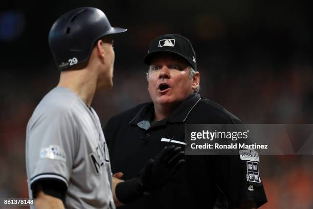 Todd Frazier of the New York Yankees aregues a call with umpire Hunter Wendelstedt in the eighth inning against the Houston Astros during game two of...