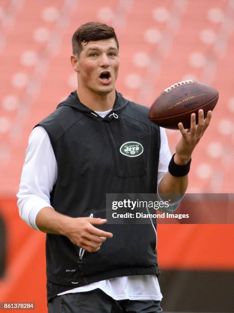 Quarterback Christian Hackenberg of the New York Jets takes part in warm ups prior to a game on October 8, 2017 against the Cleveland Browns at...