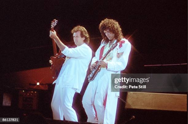 Photo of Brian MAY and QUEEN, L-R: Spike Edney and Brian May performing on stage