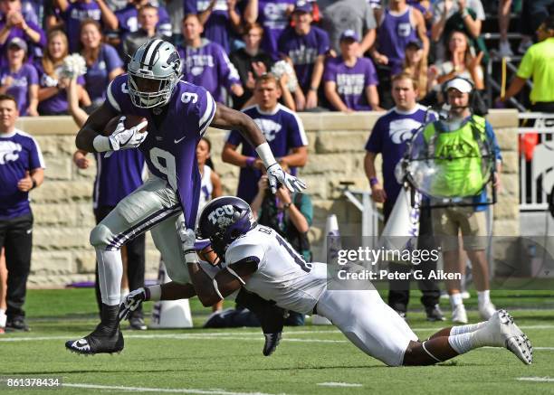 Wide receiver Byron Pringle of the Kansas State Wildcats can't brake away from defensive back Jeff Gladney of the TCU Horned Frogs during the first...