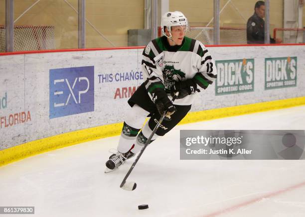 Nathan Smith of the Cedar Rapid RoughRiders skates with the puck during the game against the Sioux City Musketeers on Day 1 of the USHL Fall Classic...