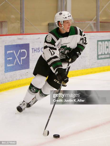 Nathan Smith of the Cedar Rapid RoughRiders skates with the puck during the game against the Sioux City Musketeers on Day 1 of the USHL Fall Classic...