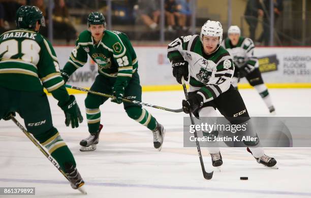 Neil Shea of the Cedar Rapids RoughRiders skates with the puck during the game against the Sioux City Musketeers on Day 1 of the USHL Fall Classic at...