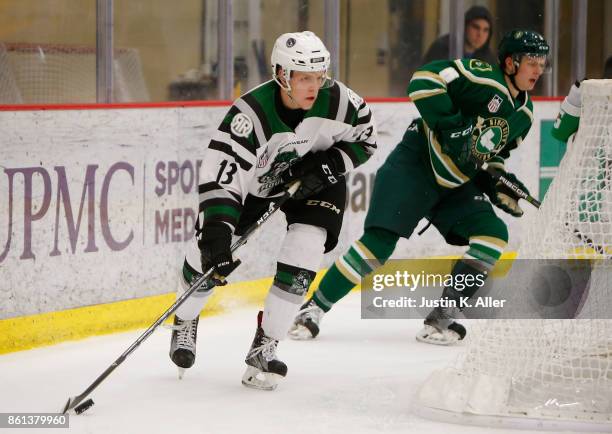 Nathan Smith of the Cedar Rapid RoughRiders skates with the puck during the game against the Sioux City Musketeers on Day 1 of the USHL Fall Classic...