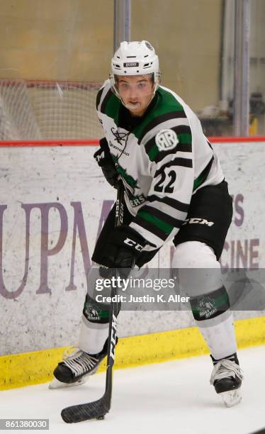 Graham Slaggert of the Cedar Rapids RoughRiders skates with the puck during the game against the Sioux City Musketeers on Day 1 of the USHL Fall...