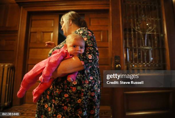 Linda Boyle holds her granddaughter, Grace. Joshua Boyle's children in their grandparents home after arriving back in Canada after Joshua and his...