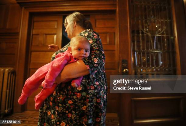 Linda Boyle holds her granddaughter, Grace. Joshua Boyle's children in their grandparents home after arriving back in Canada after Joshua and his...