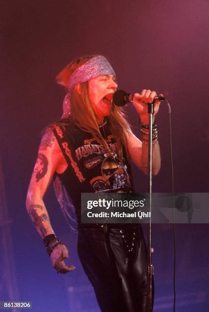 Photo of GUNS AND ROSES and Axl ROSE and GUNS & ROSES and GUNS N' ROSES, Axl Rose performing live onstage, wearing Harley Davidson t-shirt