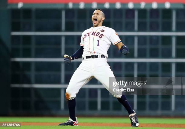 Carlos Correa of the Houston Astros celebrates their 2 to 1 win over the New York Yankees in game two of the American League Championship Series at...