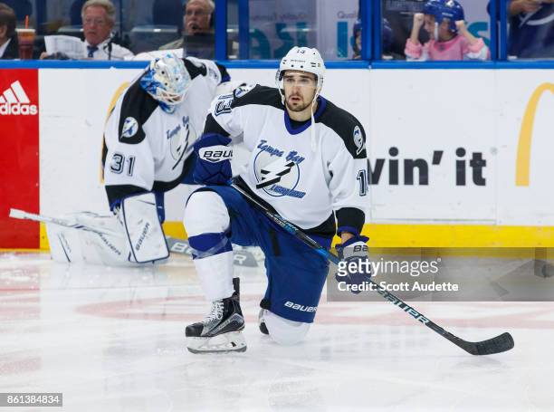 Cedric Paquette of the Tampa Bay Lightning dons a 1992-93 home jersey for pregame warm ups against the St Louis Blues at Amalie Arena on October 14,...