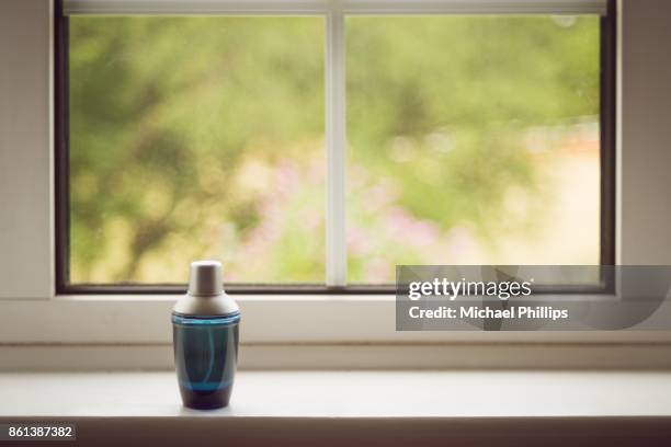 bottle on window - window sill stock pictures, royalty-free photos & images