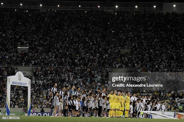 Players of Botafogo and Vasco da Gama listen the national anthem before the match between Vasco da Gama and Botafogo as part of Brasileirao Series A...