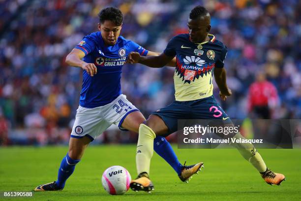 Alex Ibarra of America struggles for the ball against Victor Zuniga of Cruz Azul during the 13th round match between Cruz Azul and America as part of...