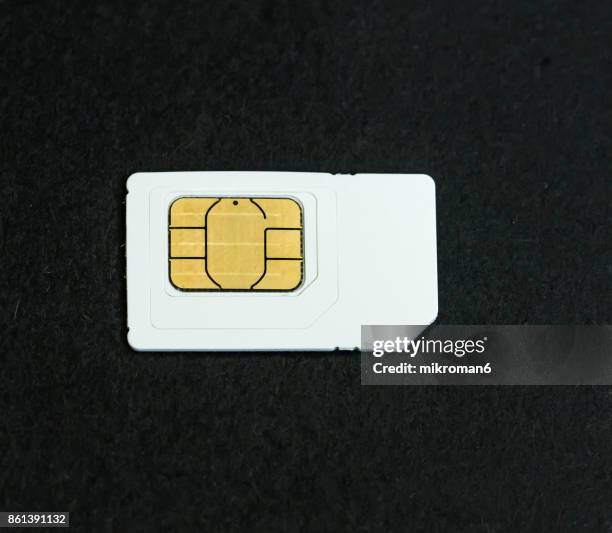 close-up of sim card on black background - all sim card stock pictures, royalty-free photos & images