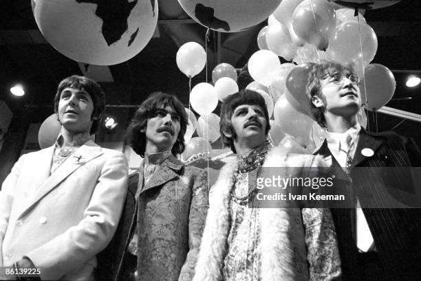 From left, Paul McCartney, George Harrison , Ringo Starr and John Lennon of English rock and pop group The Beatles pose together during a press call...