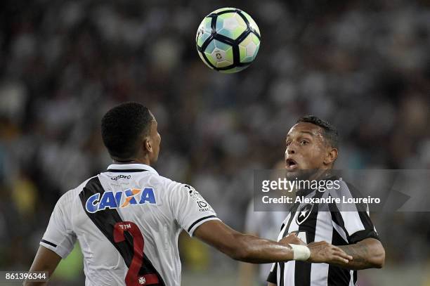 Madson of Vasco da Gama battles for the ball with Guilherme of Botafogo during the match between Vasco da Gama and Botafogo as part of Brasileirao...