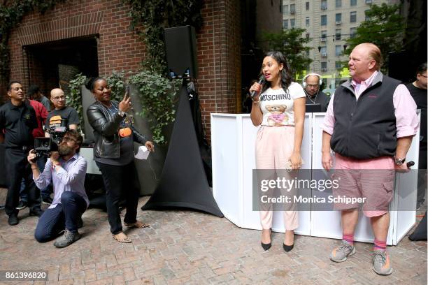 Of Food Bank Margarett Purvis, Television Personality Ayesha Curry and Chef Mario Batali speak during Family Ice Cream Fun-dae hosted by Mario Batali...