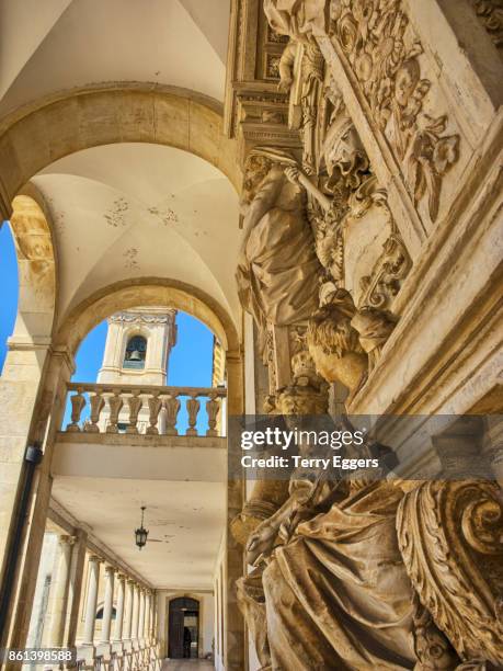 entrance to the ancient university of coimbra with the via latina colonnade - coimbra stock pictures, royalty-free photos & images