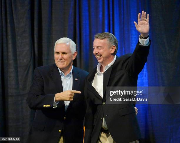 Vice President Mike Pence, left, points to gubernatorial candidate Ed Gillespie, R-VA, during a campaign rally at the Washington County Fairgrounds...