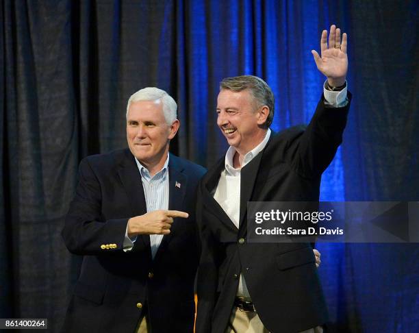 Vice President Mike Pence, left, points to gubernatorial candidate Ed Gillespie, R-VA, during a campaign rally at the Washington County Fairgrounds...