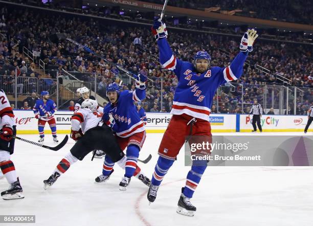 Rick Nash of the New York Rangers scores at 5:31 of the second period against the New Jersey Devils and is joined by Jesper Fast at Madison Square...