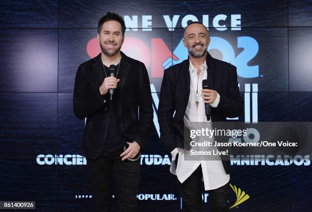 In this handout photo provided by One Voice: Somos Live!, Pablo Hurtado and Mario Domm of 'Camila' pose in the pressroom at One Voice: Somos Live! A...