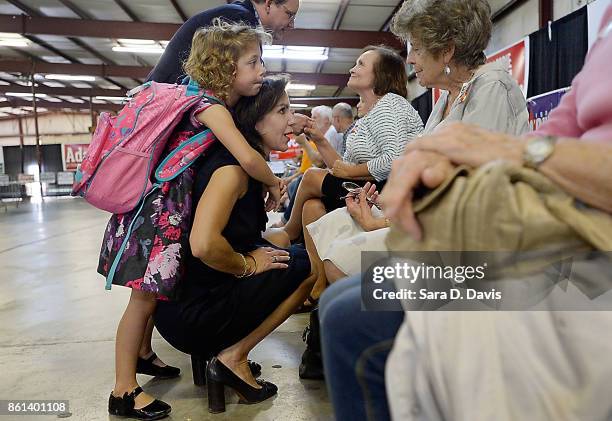 Jill Vogel, Virginian Republican lieutenant governor candidate, and her daughter Olivia, talk attendees at a campaign rally at the Washington County...