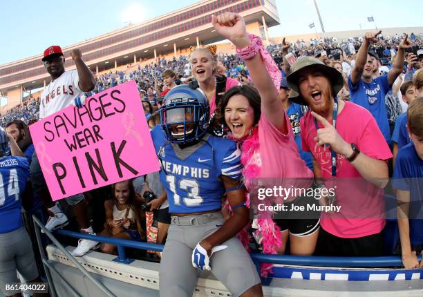 Kedarian Jones of the Memphis Tigers celebrates with fans after the game against the Navy Midshipmen on October 14, 2017 at Liberty Bowl Memorial...