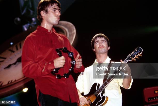 Photo of Noel GALLAGHER and Liam GALLAGHER and OASIS, L-R: Liam Gallagher and Noel Gallagher performing live onstage