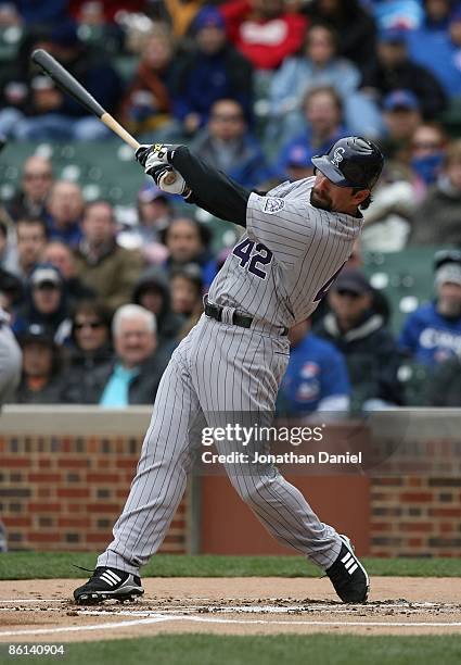 Todd Helton of the Colorado Rockies, wearing a jersey on Jackie Robinson Day, swings the bat against the Chicago Cubs on April 15, 2009 at Wrigley...