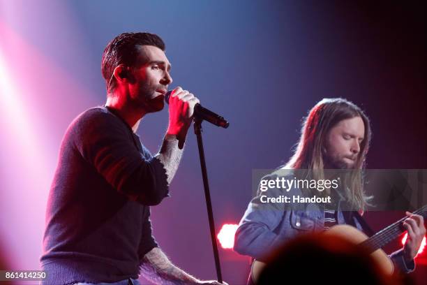 In this handout photo provided by One Voice: Somos Live!, Adam Levine and James Valentine of Maroon 5 perform onstage during "One Voice: Somos Live!...