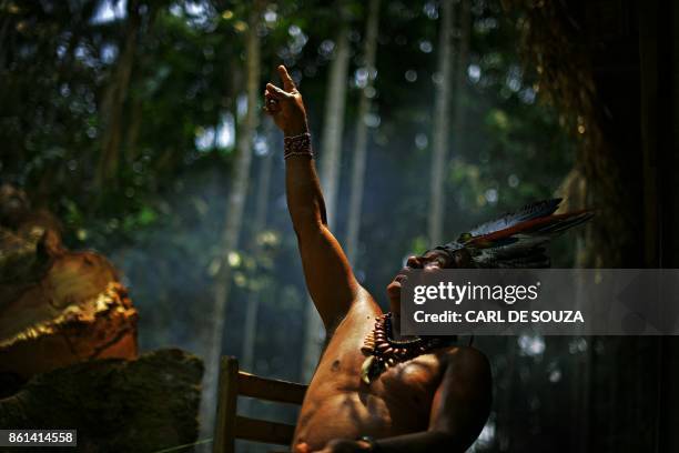 Chief Marcelino Apurina, of the Aldeia Novo Paraiso gestures as he speaks in the Western Amazon region of Brazil, near Labrea on September 21, 2017....