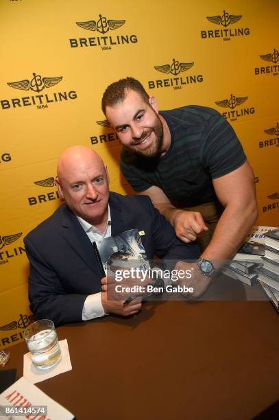 Retired Astronaut Scott Kelly poses with a guest during Breitling Celebrates Former NASA Astronaut and Current Breitling Ambassador Scott Kelly's New...