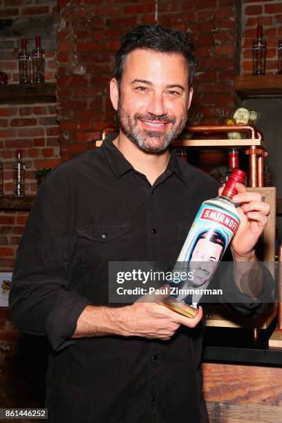 Jimmy Kimmel poses with a bottle of Smirnoff painted with his image during the Jimmy Kimmel Live! Welcome to Brooklyn kick-off hosted by SMIRNOFF...