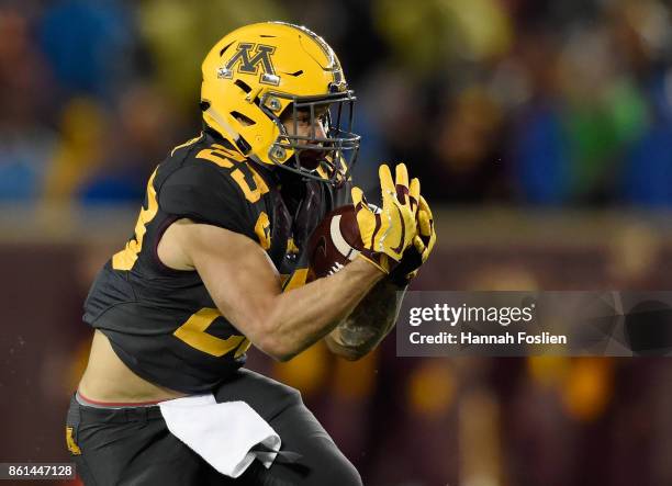 Shannon Brooks of the Minnesota Golden Gophers makes a reception of the ball against the Michigan State Spartans during the second quarter of the...