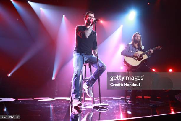 In this handout photo provided by One Voice: Somos Live!, Adam Levine and James Valentine of Maroon 5 peform onstage during "One Voice: Somos Live! A...
